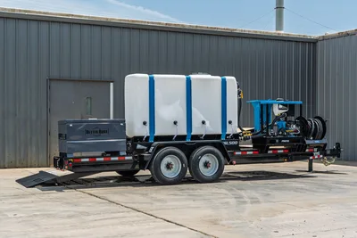 Behnke TBCT2220ET-BT-R HDD mud mixing trailer, 3/4 view, white poly tank, blue straps, Better Built toolbox, pump unit, hose reel