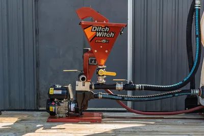 Ditch Witch FM5x mud mixing hopper with gas engine, ball valves, and Black Gold Super-Vac hose connections on 2023 MAXX-D C6X trailer