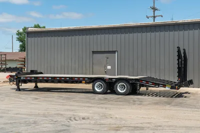 2026 Behnke FB8X30SDPT-40L flatbed pintle hitch trailer, full side profile, tandem axle, fold-down ramps, reflective marker lights