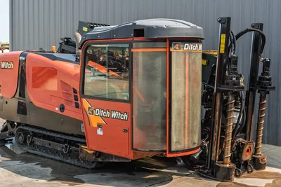 2017 Ditch Witch JT30 HDD rig, operator cab close-up, drill carriage, auger/drill pipe, rubber tracks, orange livery