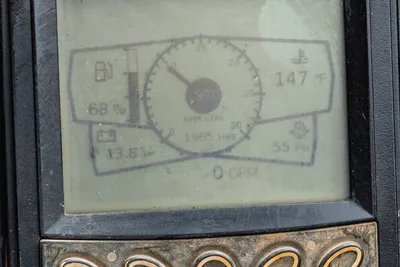 Ditch Witch JT10 digital operator display showing 1,985 engine hours, 147F coolant temp, 55 PSI, and 68% fuel level.