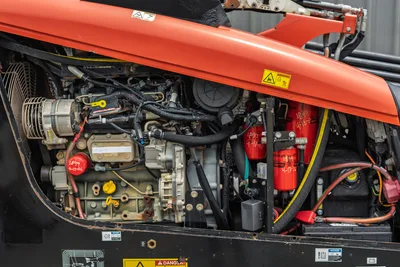 Close-up engine compartment of 2018 Ditch Witch JT10 horizontal directional drill showing filters and cooling system.
