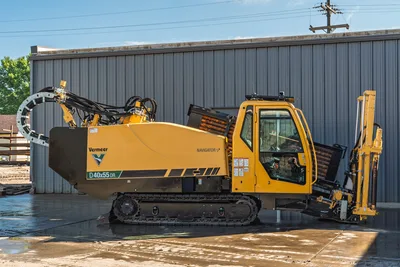 Vermeer 40x55DR S3 HDD rig with tracked undercarriage, yellow and black cab, drill head, and reels, side profile view