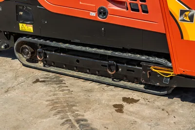 2016 Ditch Witch JT30 All Terrain side view, highlighting rubber track undercarriage, machine chassis, and engine cowling.