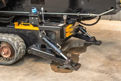 2021 Ditch Witch JT28 hydraulic anchor system, deployed ground anchor and stabilizer feet, rubber track, close-up undercarriage view