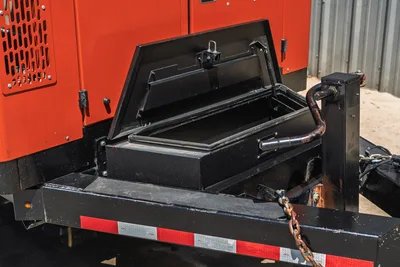 2023 Ditch Witch HX30 mud mixer trailer tongue area, open lockable tool storage box, safety chains, reflective tape