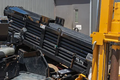 2021 Vermeer D24x40 S3 drill pipe rack loaded with 2.375" HDD drill rods, angled carousel view, used condition