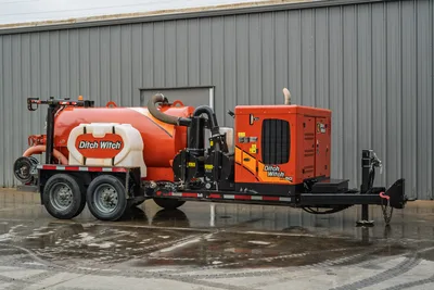 2021 Ditch Witch HX50 mud recycler, trailer-mounted, 3/4 driver-side view, orange tank, vacuum hose, engine enclosure