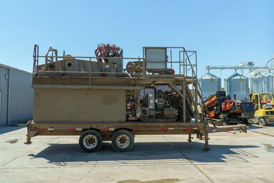 2018 Mud Technologies MCT-450 mud recycler on tandem-axle trailer, full side view, shaker deck, engine, pump, walkway grating visible