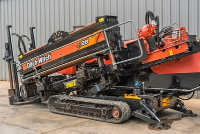 2021 Ditch Witch JT28 HDD drill, driver-side angle, elevated thrust frame, rubber tracks, hydraulic components, anchor system, drill pipe loaded
