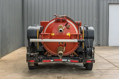 2023 Ditch Witch HX50 mud mixer, rear view, red mixing tank, dual black poly water tanks, hose reel, brass fittings, discharge plumbing