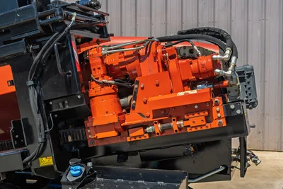 Close-up of Ditch Witch JT30 All Terrain carriage and hydraulic drive motor assembly on horizontal directional drill.