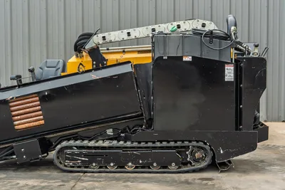 2018 Vermeer D8x12 HDD drill, right-side profile, rubber tracks, operator seat, drill pipe rack loaded, black engine enclosures visible