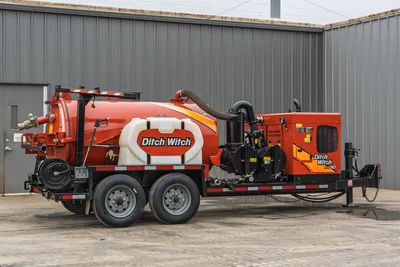 2019 Ditch Witch HX30 vacuum excavator, side profile, showing debris tank, water tank, engine compartment, and hose boom.