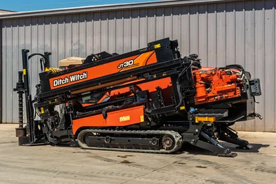 2016 Ditch Witch JT30 All Terrain HDD drill side profile, showing track undercarriage, drill pipe rack, and engine housing.
