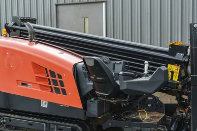 2015 Ditch Witch JT20 HDD operator station, joystick controls, loaded drill pipe rack, red engine hood, rubber tracks