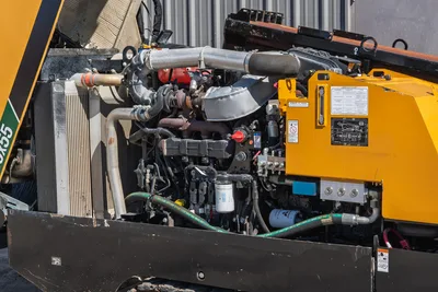 2021 Vermeer D40x55 S3 open engine compartment showing diesel engine, turbo, radiator, hydraulic manifold, and fluid filters