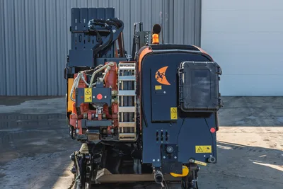 Rear view of 2023 Ditch Witch JT20 HDD drill showcasing engine compartment, pipe rack, and carriage assembly.