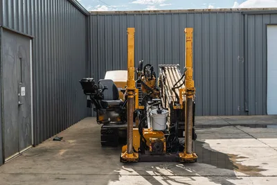 2018 Vermeer D24x40 S3 HDD rig, rear view showing drill pipe rack, anchor posts, operator seat, rubber tracks