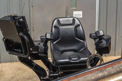 2020 Vermeer D24x40 S3 operator station with black vinyl seat, dual joystick controls, and display panel, close-up view