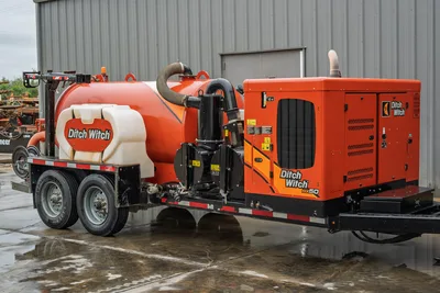 2021 Ditch Witch HX50 mud recycler, passenger-side view showing vacuum tank, mud pump, engine enclosure, tandem axle trailer