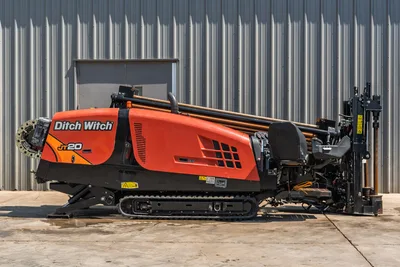2022 Ditch Witch JT20 HDD drill, full side profile, orange hood, loaded drill pipe rack, rubber tracks, drill frame visible