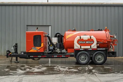 2021 Ditch Witch HX50 mud recycler, full driver-side view, trailer-mounted, orange tank, engine compartment, dual axle, good condition