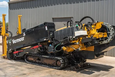 2021 Vermeer D24x40 S3 HDD drill, driver side angle, drill frame angled down, rubber tracks, hydraulic hoses, yellow carriage visible