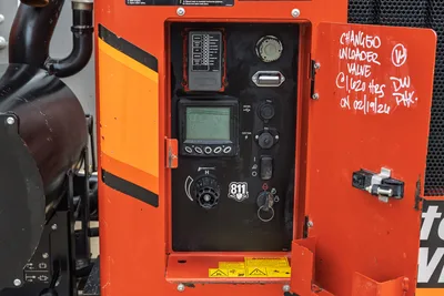 2023 Ditch Witch HX50 mud mixer control panel with LCD display, fuse block, ignition, USB/12V ports, and flow valve knob.