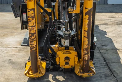 2022 Vermeer D23x30 S3 HDD drill head-on view showing carriage, vise assembly, hydraulic lines, and anchor posts with wear.
