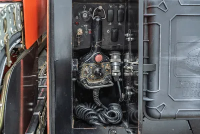 Ditch Witch JT20 engine compartment showing 74 hp motor, hydraulic manifold, control panel, and interconnected drill components at close-up angle