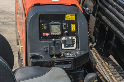 2018 Ditch Witch JT10 operator station with ESID display, control panel, joystick, and drill pipe rack in good condition.