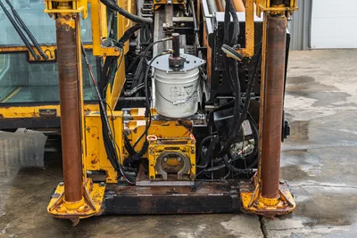 2017 Vermeer 40x55 S3 horizontal directional drill, front view showing hydraulic stabilizers, carriage, and pipe vice.