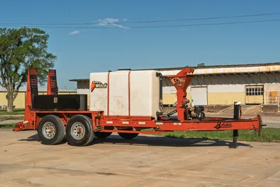 Belshe WB14-2EP trailer with 2020 Ditch Witch FM5x mixing system, white tank, orange chassis.