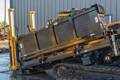 Vermeer 40x55DR S3 HDD rig side view showing thrust frame, engine compartment, and tracked carrier base