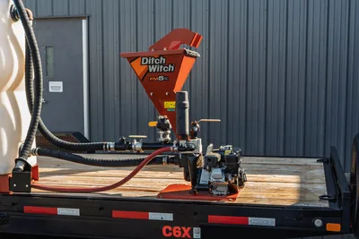 2023 MAXX-D C6X trailer deck with Ditch Witch FM5x mud mixer, gas engine pump, suction hoses, and manifold plumbing
