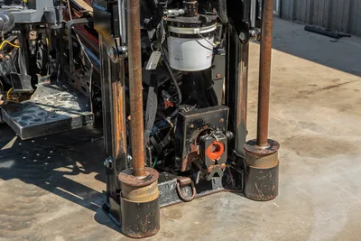 2018 Ditch Witch JT20 drill rig front view, showing pipe rack, carriage, operator platform, and hydraulic stabilizers.