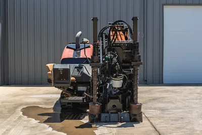 2018 Ditch Witch JT30 All Terrain HDD rig, rear view showing drill frame, hydraulic lines, anchors, and red engine hood