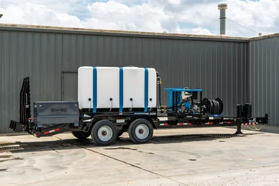 2026 Behnke CBCT2324E-BT-R HDD mud mixing trailer, side view, white poly tank with blue straps, Better Built toolbox, hose reel, PM70 pump unit