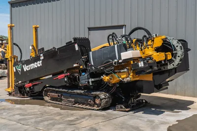 2020 Vermeer D24x40 S3 HDD drill, angled view, drill frame raised, rubber tracks, hydraulic hoses, yellow carriage chain drive visible