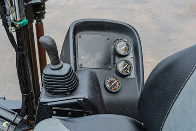 2016 Ditch Witch JT9 operator console showing joystick control, three analog gauges, and seat; wear-consistent with 2,256 hours