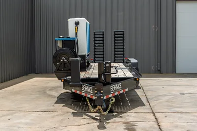 2026 Behnke CBCT2324E-BT-R HDD trailer, front view, wood deck, hose reel, water tank, pipe racks, safety chains, reflective striping