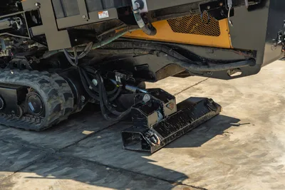 2022 Vermeer D23x30 S3 HDD undercarriage detail showing rubber track, hydraulic lines, and anchor plate assembly