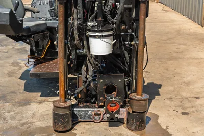 2022 Ditch Witch JT20 rear carriage close-up showing drill rod vise, anchor posts, hydraulic hoses, and operator seat