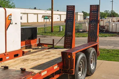 2016 Belshe WB14-2EP trailer, partial Ditch Witch mixer visible, rear quarter view, ramps up.