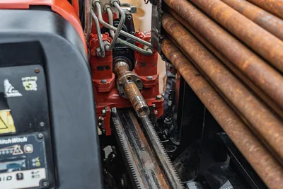 2016 Ditch Witch JT9 spindle and drill drive closeup, rack-and-pinion carriage, loaded drill pipe rack, used condition