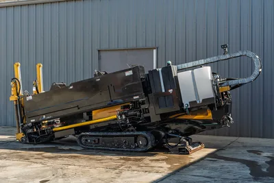 2016 Vermeer D23x30 S3 HDD drill, side/rear angle, rubber tracks, drill frame angled up, cable carrier, fluid tank visible