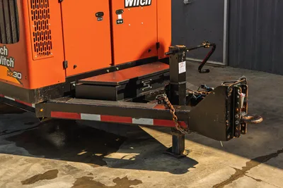 2022 Ditch Witch HX30 mud mixer trailer tongue, pintle hitch, safety chain, jack stand, storage box, orange body, close-up rear angle