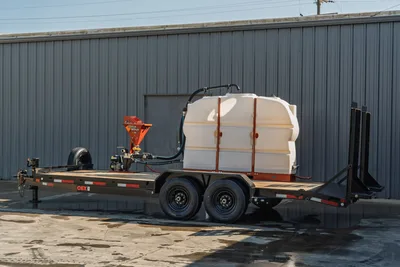 2023 MAXX-D C6X mud trailer, tandem axle, white poly water tank, Ditch Witch mud mixer, pump unit, wood deck, side angle