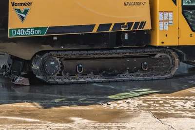 Vermeer D40x55DR S3 HDD rig side profile showing tracked undercarriage, yellow cab with Navigator branding, and dual drill head assembly